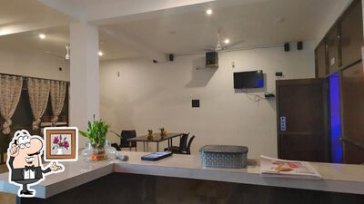 Take a seat at one of the tables at SHRI RESTO AND CAFE