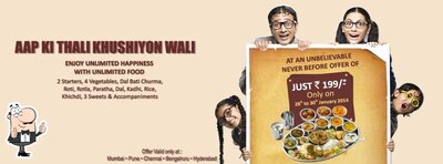 The advertisement displays information about Delhi Misthan