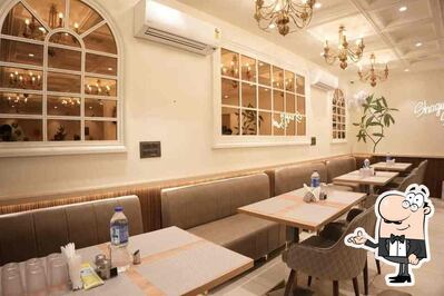 Take a seat at one of the tables at Shagun restaurant