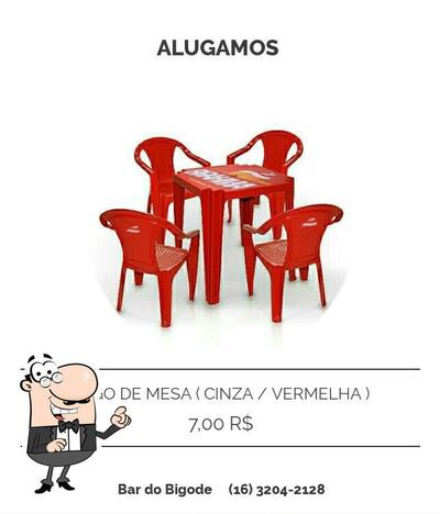 Sente em uma das mesas no Bar Do Bigode