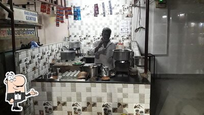 Take a seat at one of the tables at Salim Tea & Coffee Shop