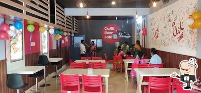 Take a seat at one of the tables at Classic Rider Cafe pondy