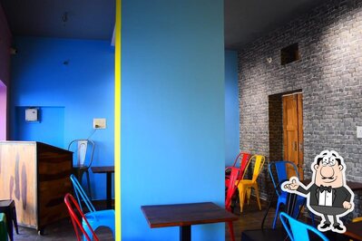 Take a seat at one of the tables at Cafe 68