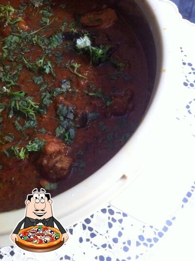 Try out pizza at Maa De Rasoi