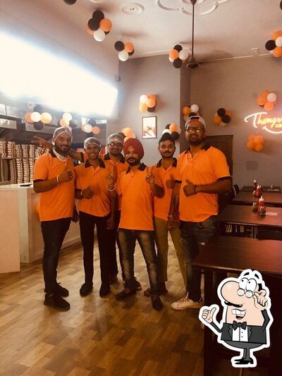 Take a seat at one of the tables at Thangrry Club