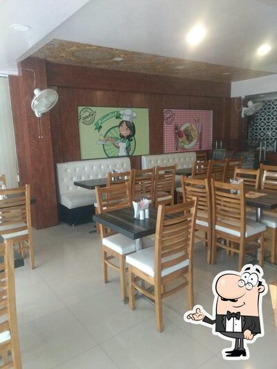 Take a seat at one of the tables at Foodiez Restaurant
