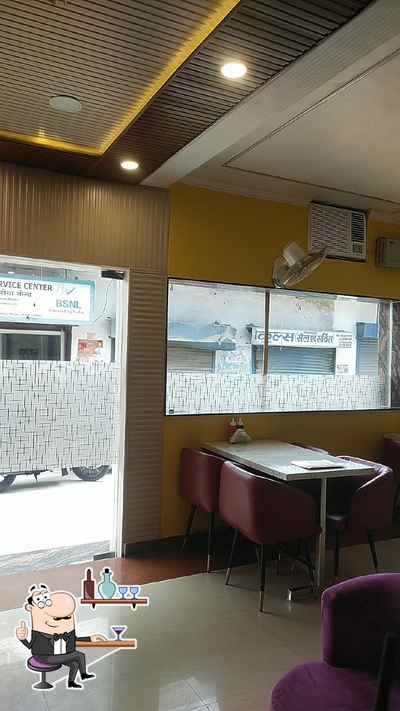 Take a seat at one of the tables at Chaat Adda