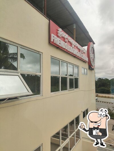 Check out how Friends Lodging & Boarding, Deluxe Rooms Hotel Near Bangalore Airport Road, Attached Family Restaurant in Devanahalli Road looks outside