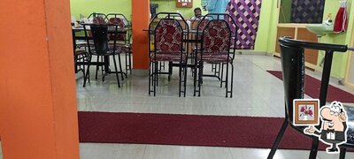 Take a seat at one of the tables at Valibhai hotel