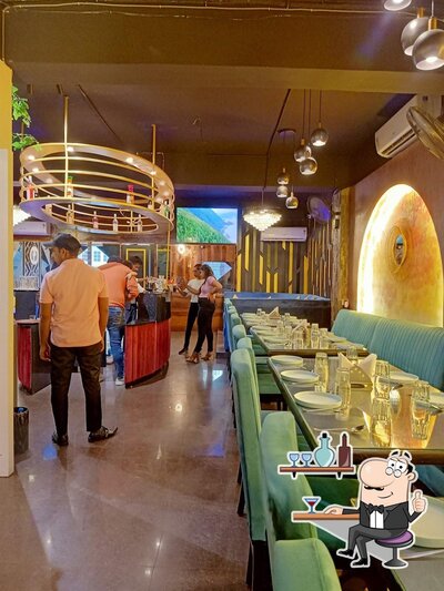 Take a seat at one of the tables at NAMASTEY BAREILLY