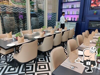 Take a seat at one of the tables at Pyramisa - The Corinthians