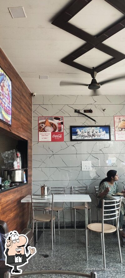 Take a seat at one of the tables at SHYAM FOODS