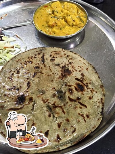 Pick pizza at Radhika Restaurant