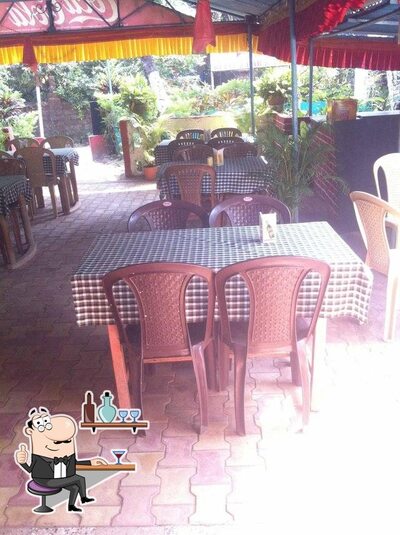 Take a seat at one of the tables at Kelly Bar and Restaurant