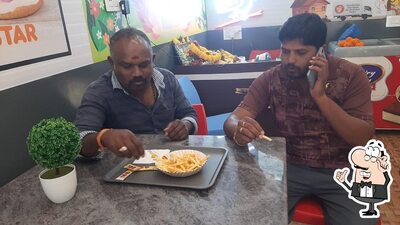 Take a seat at one of the tables at Five star Chicken