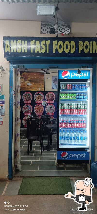 Take a seat at one of the tables at Ansh Fast Food Point
