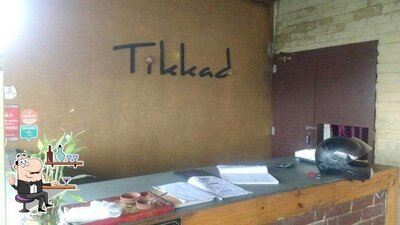 Take a seat at one of the tables at Tikkad