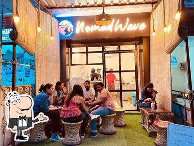Take a seat at one of the tables at Nomad Wave