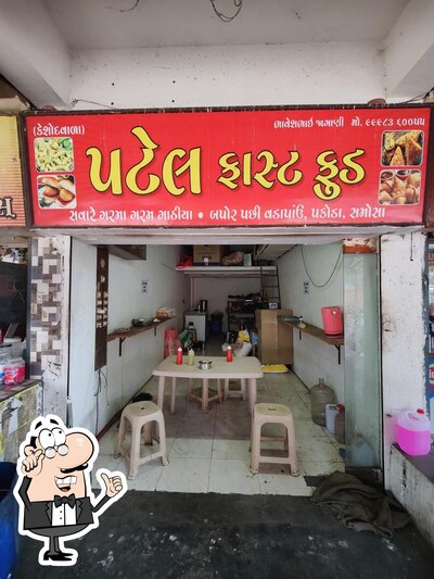 Take a seat at one of the tables at Patel Fastfood