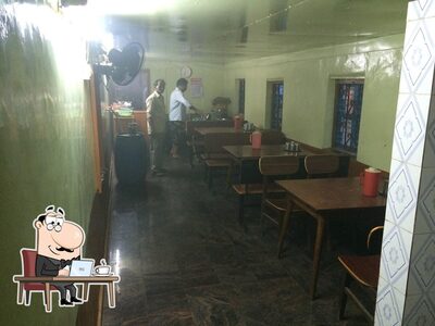 Take a seat at one of the tables at Azad Restaurant