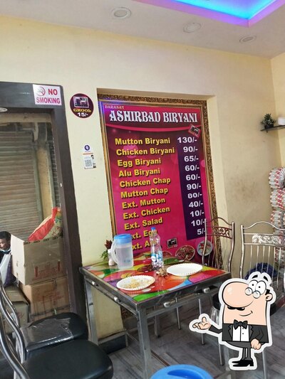 Take a seat at one of the tables at ASHIRBAD BIRYANI