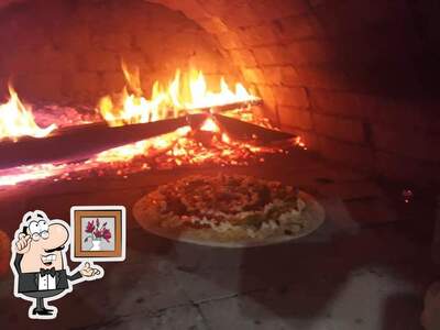 O interior do Pizzaria Beijo da Lua