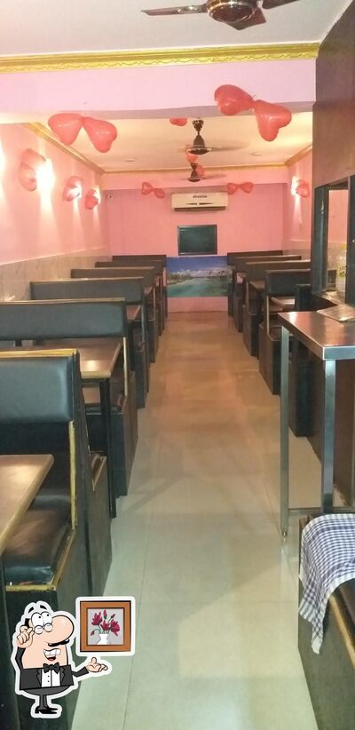 Take a seat at one of the tables at Hotel Maalaxmi
