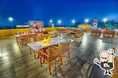 Take a seat at one of the tables at Agashey Restaurant