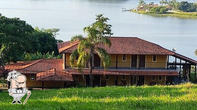 Desfrute da vista do exterior Pousada Enseada do Lago