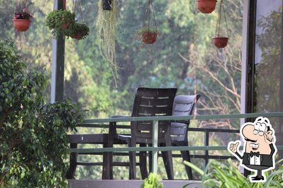 Take a seat at one of the tables at Gurusparsh Resort
