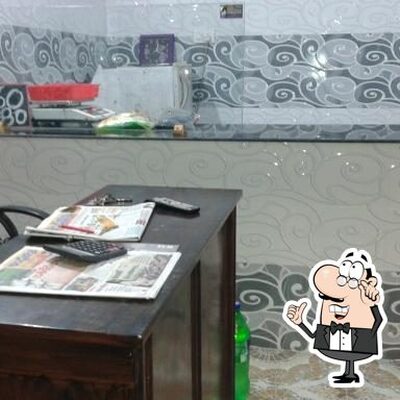 Take a seat at one of the tables at S.R Chicken Center