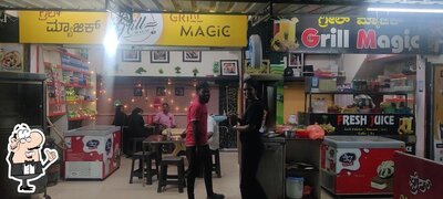 Take a seat at one of the tables at Grill magic