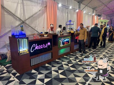 Take a seat at one of the tables at Tipsy bartender