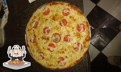 No LANCHONETE E PIZZARIA DO BADEJO, você pode degustar pizza