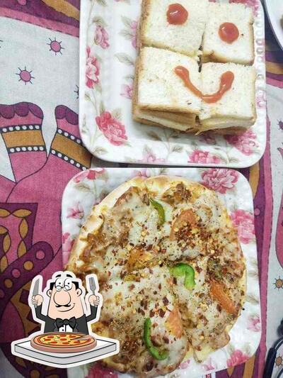 Get pizza at Dilip Fast Food