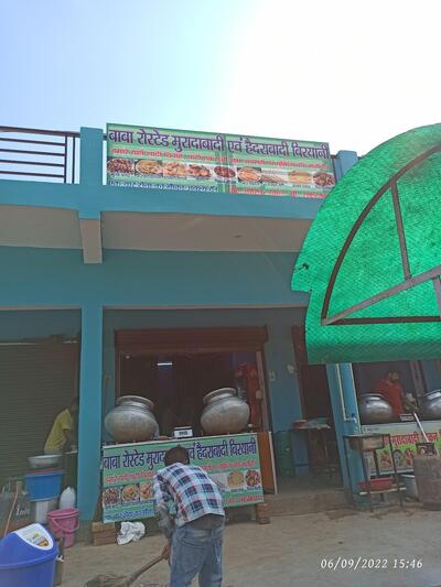 The advertisement displays information about BaBa Restaurant