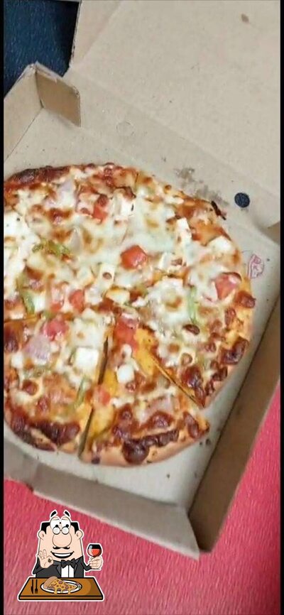 Get pizza at Komali Restaurant