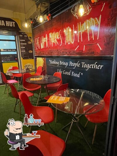 Take a seat at one of the tables at Shawarma Hut