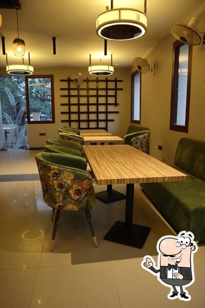 Take a seat at one of the tables at La'Chef Restaurant