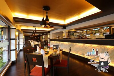 Take a seat at one of the tables at Emperor