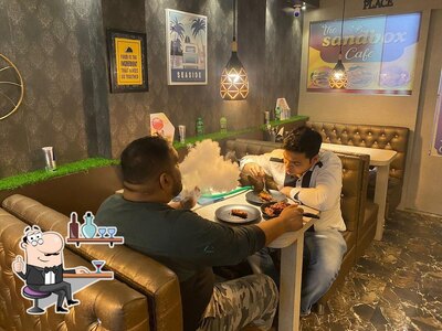 Take a seat at one of the tables at The Sandbox Cafe
