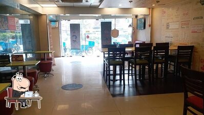 Take a seat at one of the tables at Domino's Pizza