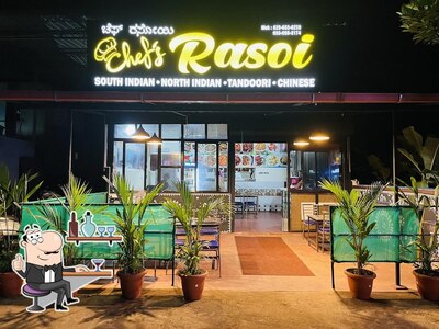Take a seat at one of the tables at Chef's Rasoi Restaurant