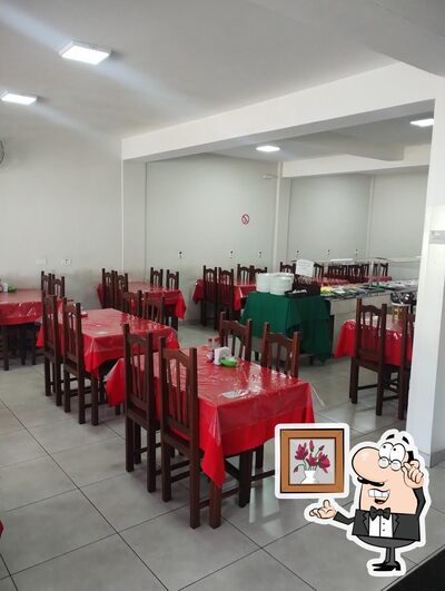 Sente em uma das mesas no Restaurante Casa Nova - Formiga-MG