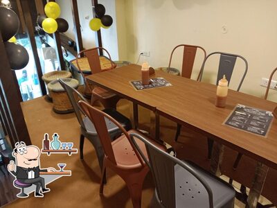 Take a seat at one of the tables at Singing Beans Cafe