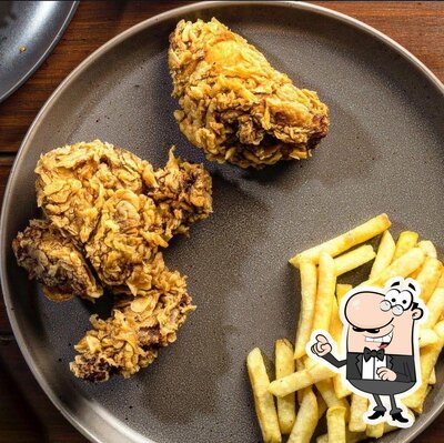 Take a seat at one of the tables at AL_RAHIM_Chicken_Fast_Food