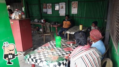Take a seat at one of the tables at GOPAL TEA STALL & CLUB