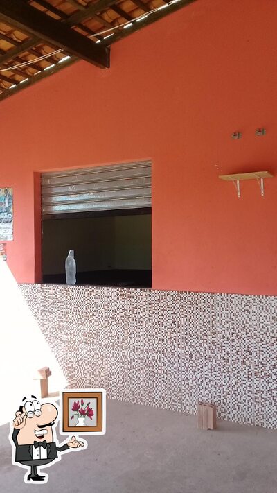 Sente em uma das mesas no Bar Do Pichula