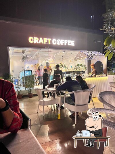 Take a seat at one of the tables at Craft Coffee City Centre Mall Patna