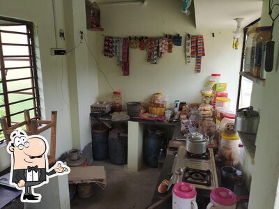 Take a seat at one of the tables at Chotka Tea stall